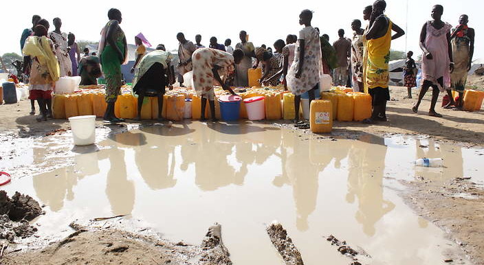 Photo: South Sudanese women collect water in the United Nations base camp in Bor, Jonglei state. (Ilya Gridneff)