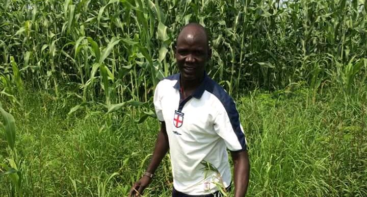 Photo:Abel Majur stands in his farm.jpg