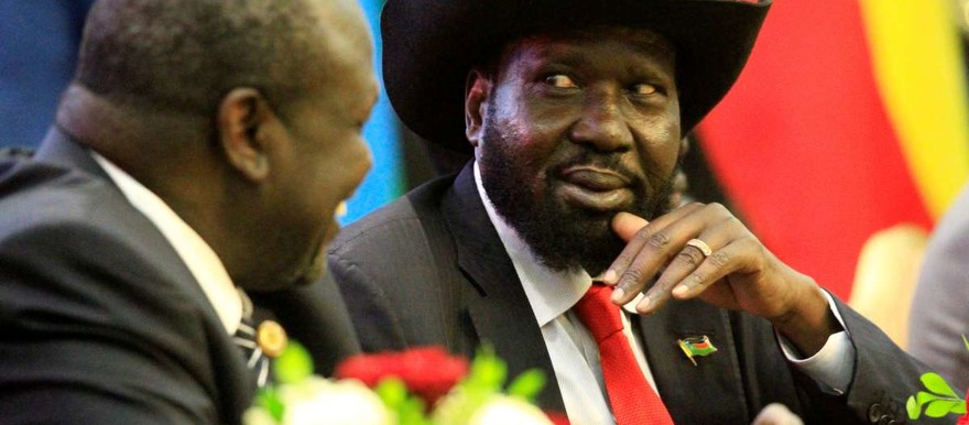 South Sudan's President Salva Kiir (right) talks to rebel leader Riek Machar. MOHAMED NURELDIN ABDALLAH / REUTERS