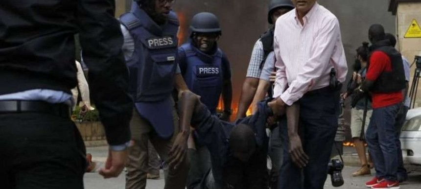 Journalists rescue a victim of the terror attack at Dusit hotel. /MONICA MWANGI