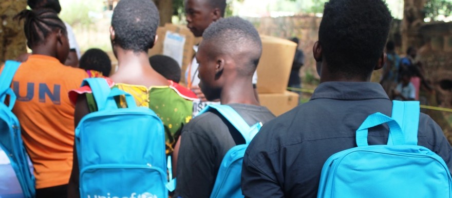 Former child soldiers line up to receive livelihood start-up kits after being officially released in Yambio, capital of Gbudue State on Jan 31, 2019