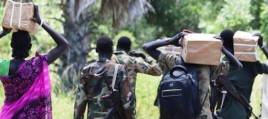 SPLA-IO soldiers carry boxes with forms delivered by JMCC members to register forces in Ayod County on September 24, 2019. (Photo: Radio Tamazuj)