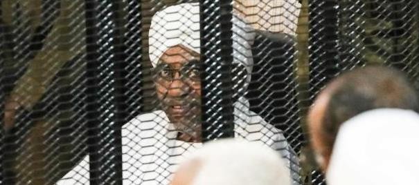 Omar al-Bashir sits in a defendant's cage during his corruption trial in Khartoum on August 24, 2019. (CNN)