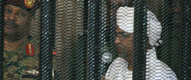 Former president Omar al-Bashir in court in a cage on 19 August, 2019 [AFP]