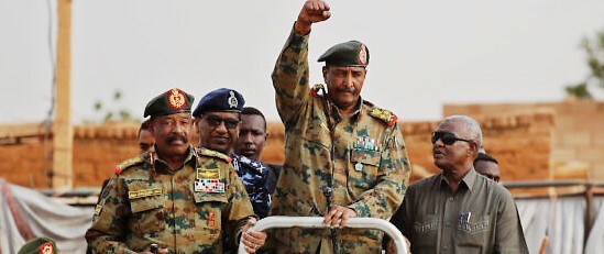 Gen. Abdel-Fattah al-Burhan, head of the military council, waves to his supporters upon arriving attend a military-backed rally, in Omdurman district, west of Khartoum, Sudan, June 29, 2019. (AP Photo/Hussein Malla