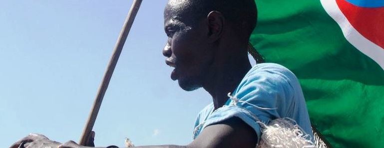 A man carried a South Sudan flag. (CHOL/AFP/Getty Images)
CHOL/AFP/Getty Images)