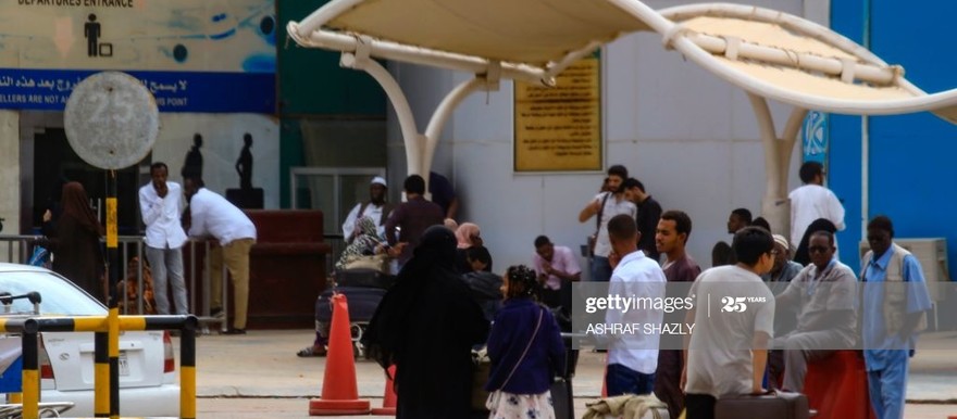 Passengers wait outside the departure terminal at Khartoum airport on May 28, 2019 (Photo: ASHRAF SHAZLY/AFP via Getty Images)