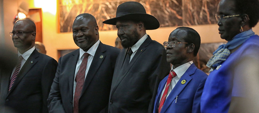 UNMISS/Nektarios Markogiannis | President Salva Kiir (centre right) shakes hands with Riek Machar, who was sworn in as First Vice President on 22 February 2020.