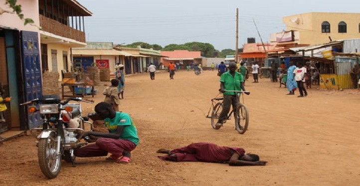 A woman collapsed from hunger in the streets of Aweil, South Sudan. (Credit: Nicholas Kristof/The New York Times)