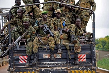 Ugandan soldiers ride near Nimule town along the South Sudan and Uganda border, July 14, 2016. REUTERS/Anthony Nambwaya