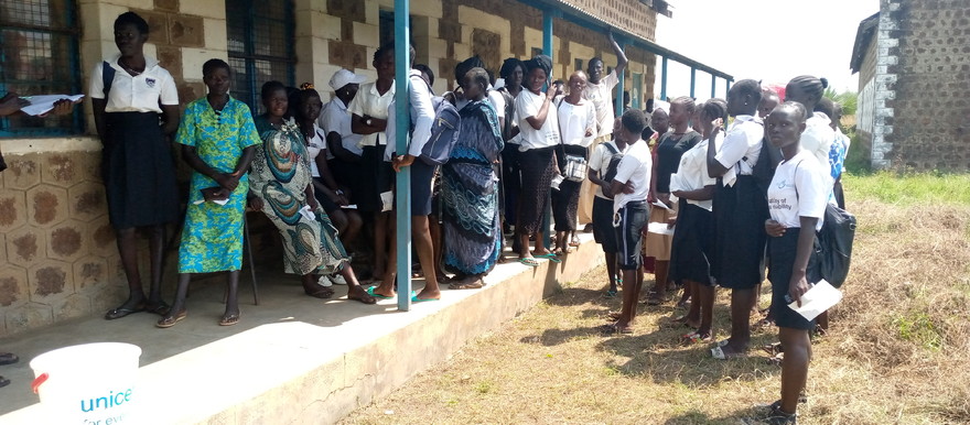 School girls receiving GESS cash transfers at Torit day secondary school 25th November 2020 [Photo: Radio Tamazuj]