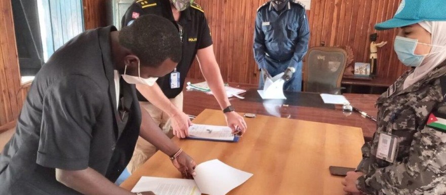 The necessary paperwork for UNPOL to hand over a vehicle to the South Sudan police being done. [Photo: Dawit Kahsay Tedla/UNMISS]