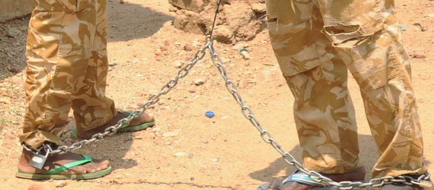 Soldiers suspected of beating and raping civilians are chained together within the army headquarters, after their arrest in Juba, March 3, 2017.