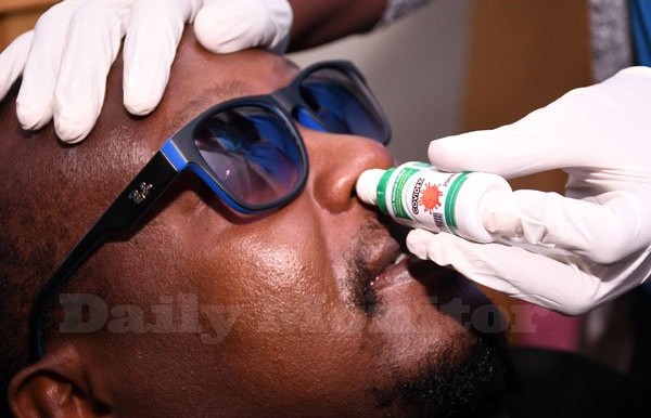 A man received drops of the Covidex herbal medicine as a treatment for Covid-19 recently in Kampala, Uganda. [Photo: Rachel Mabala/Daily Monitor]