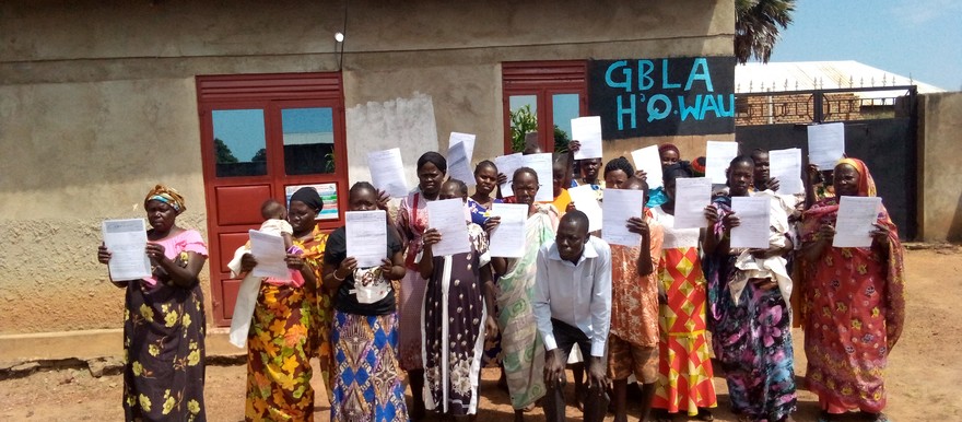 Beneficiaries pose for a photo after receiving their land certificates at the GBLA office on 23, September 2021 [Photo: Radio Tamazuj].