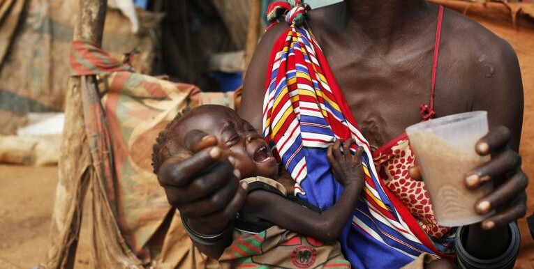 Madelina, who suffers from malnutrition, is being fed by her mother in the street, where they live, in Juba, South Sudan, on December 10th, 2018. [Photo: UNICEF]