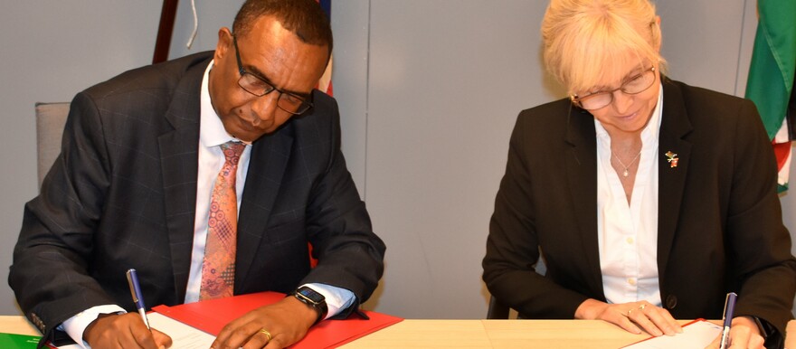 Chairperson of CTSAMVM) Major General Hailu Gonfa Eddosa, (L) and the Norwegian Ambassador to South Sudan, Linken Nymann Berryman (R), sign a funding deal on Thursday, June 22, 2023. @CTSAMVM.