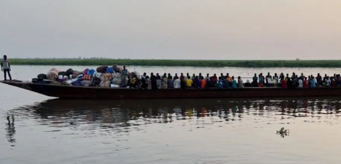 Returnees who fled violence in Sudan being transported on a boat from Renk to Malakal,. (JRS photo)