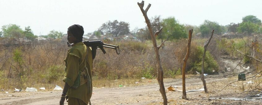 File photo: An armed individual in the town of Pibor. OCHA/Cecilia Attefors