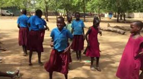 Pupils of St. Bakhita Girl’s Boarding Primary School play in the compound during a break. (Courtesy photo)