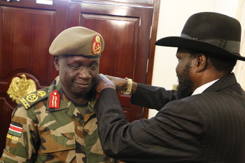 Photo: Gen. James Ajongo being promoted by President Kiir before swearing in as new chief of general staff on May 10, 2017. (Radio Tamazuj)