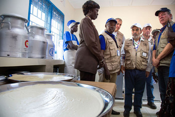 Photo: FAO Director-General José Graziano da Silva (centre) and WFP Executive Director David Beasley (right) at the Rumbek milk processing plant in South Sudan. (FAO/Albert González Farran)