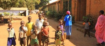 File photo: Young IDPs play in front of church buildings at the St. Mary Help of Christians Cathedral in Wau, Western Bahr el Ghazal, Dec. 8, 2016. (J. Craig/VOA)