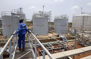 File photo: A worker walks at the power plant of an oil processing facility at an oilfield in Unity State. (REUTERS/Goran Tomasevic)