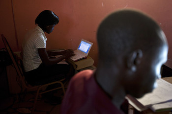 File photo: Two reporters at "The Citizen" newspaper work at their desks in Juba, South Sudan, 18 June 2012/REUTERS