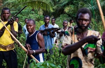 Photo: 'Arrow Boys' in Western Equatoria in 2012, by Pulitzer Center/Trevor Snapp