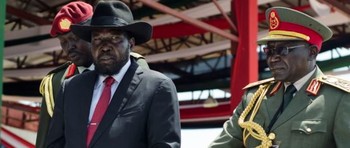 File photo: President Kiir, center, accompanied by Paul Malong, right, attends an Independence Day ceremony in Juba, July 9, 2015.