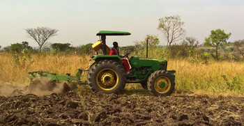 Agricultural service provider ploughing the fields of farmers in Morobo.