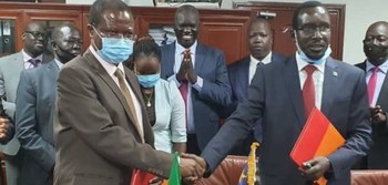 Dr. Patrick Mugoya, left, shakes hands with Garang Majak, first undersecretary at the Ministry of Finance in Juba on Monday, October 5, 2020 | Credit/Eye Radio