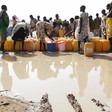 Photo: South Sudanese women collect water in the United Nations base camp in Bor, Jonglei state. (Ilya Gridneff)