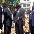 Photo: President Kiir (in hat) talking to Parliamentary Affairs Minister Makuei Lueth.  (Credit: The Niles)