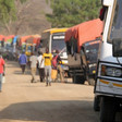 Photo: A convoy carries 3,000 newly arrived South Sudanese refugees to Palorinya settlement in northern Uganda. (© UNHCR/Catherine Wachiaya)