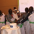 Thuraya, G4T, and NCA officials cut a cake at the launch ceremony. (Photo: Radio Tamazuj)