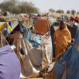 A displaced woman stands amid makeshift structures at a camp in Darfur. 9File photo)